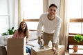 Excited young family couple preparing things stuff for delivery. Royalty Free Stock Photo