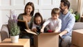 Excited family with little kids settle at new home Royalty Free Stock Photo