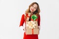 Excited young girl wearing Christmas dress standing Royalty Free Stock Photo