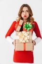 Excited young girl wearing Christmas dress standing Royalty Free Stock Photo