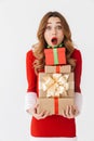 Excited young girl wearing Christmas dress standing Royalty Free Stock Photo