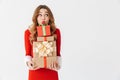 Excited young girl wearing Christmas dress standing Royalty Free Stock Photo