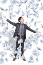 Excited Young handsome businessman watching the money rain falling Royalty Free Stock Photo