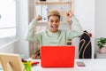 Excited young hispanic latin man celebrating good news using laptop at home Royalty Free Stock Photo