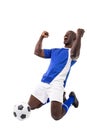 Excited young male african american soccer player celebrating after scoring goal on white background Royalty Free Stock Photo