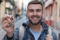 Excited young male holding house keys Royalty Free Stock Photo