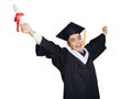 Excited young man in  black graduation gown and cap  showing diploma Royalty Free Stock Photo