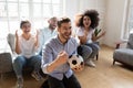 Excited young man in eyeglasses celebrating favorite team goal. Royalty Free Stock Photo