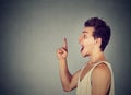 Excited young man has a new idea pointing finger up Royalty Free Stock Photo