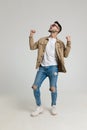 Excited young man holding fists in the air and looking up Royalty Free Stock Photo