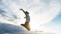 Excited young man jumping high up in the air Royalty Free Stock Photo