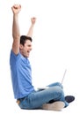 Excited young man using laptop Royalty Free Stock Photo