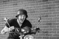 Excited Young Man Wearing Helmet on Motorcycle Royalty Free Stock Photo