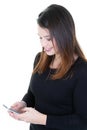 Excited young pretty woman looking mobile phone smiling. Woman reading text message isolated over white background Royalty Free Stock Photo