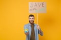 Excited young protesting man hold protest sign broadsheet placard on stick, Earth world globe isolated on yellow