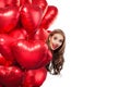 Excited young woman with balloons red heart isolated on white background. Surprised girl. Surprise, valentines people Royalty Free Stock Photo