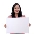 Excited young woman holding empty white board Royalty Free Stock Photo