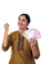 Excited young woman holding Indian 2000 rupee notes