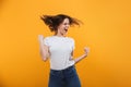 Excited young woman make winner gesture. Royalty Free Stock Photo