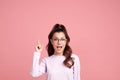 Excited young woman pointing finger up at copy space on yellow background, Emotional lady showing empty space, place for ad Royalty Free Stock Photo