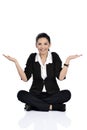 Excited young woman sitting on ground