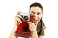 Excited young woman taking a picture with camera Royalty Free Stock Photo