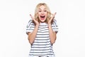 Excitement and amazement. Attractive young woman screaming with joy, with eyes full of happiness, excited. Royalty Free Stock Photo