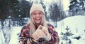EXCITEMENT CONCEPT. Portrait of happy beautiful fun young woman smiling, laughing at camera at snowy forest slow motion. Royalty Free Stock Photo