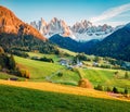 Exciting evening view of Santa Magdalena village in front of the Geisler or Odle Dolomites Group. Colorful autumn sunset in Dolomi Royalty Free Stock Photo