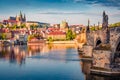 Exciting spring cityscape Prague with Charles Bridge and Castle and St. Vitus cathedral