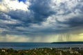 Exciting stormy clouds and rain over the sea Royalty Free Stock Photo