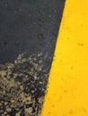 Exciting yellow and black graphic texture painted on rough surface.