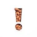 Exclamation mark of nuts almonds and cut paper isolated on white. Warning and keep attention concept