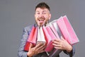 Exclusive commercial offer. Man bearded businessman customer carry many shopping bags. Enjoy shopping profitable deals