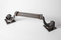 Exclusive door handle made of blacksmith. Forged, handmade handle. Close-up view. Forge production. Architectural detail