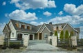 Executive Mansion Home House Maison Rock Stucco Front Exterior Cloudy Cumulus Sky Background Royalty Free Stock Photo