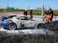 Exclusive sports car caught fire in the middle of the highway Royalty Free Stock Photo