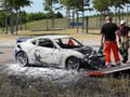 Exclusive sports car caught fire in the middle of the highway Royalty Free Stock Photo