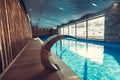 Exclusive swimming pool in a wellness hotel.Luxury resort indoor swimming pool with beautiful clean blue water Royalty Free Stock Photo