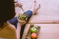 Excretory good system concept,Woman hand holding and eating healthy salad for breakfast in the morning at home Royalty Free Stock Photo