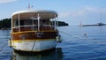 Excursion boat anchored in marina