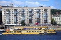 The excursion boat with passengers is sailing over the Dnieper river