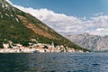 Excursion boat sails along the Bay of Kotor along the coast of Perast. Montenegro Royalty Free Stock Photo