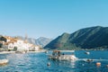 Excursion boat sails along the Bay of Kotor to the coast of Perast. Montenegro Royalty Free Stock Photo