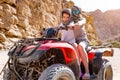 Excursion on quad bike with kid girl and her trainer Royalty Free Stock Photo
