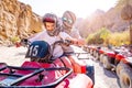 Excursion on quad bike with kid girl and her trainer Royalty Free Stock Photo