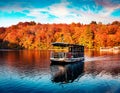 Excursion ship on the lake. Fantastic autumn sunset on Plitvice lake. Captivating morning landscape of Croatia, Europe. Traveling