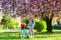 Excursion to garden. Athletic woman ride retro bicycle. Travel by bike. Weekend concept. Spring holidays. Riding bicycle Royalty Free Stock Photo