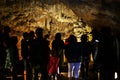 Excursion with tourists to the Sfendoni cave with stalactites, stalagmites and stalagnates underground