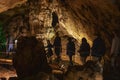 Excursion with tourists to the Sfendoni cave with stalactites, stalagmites and stalagnates underground